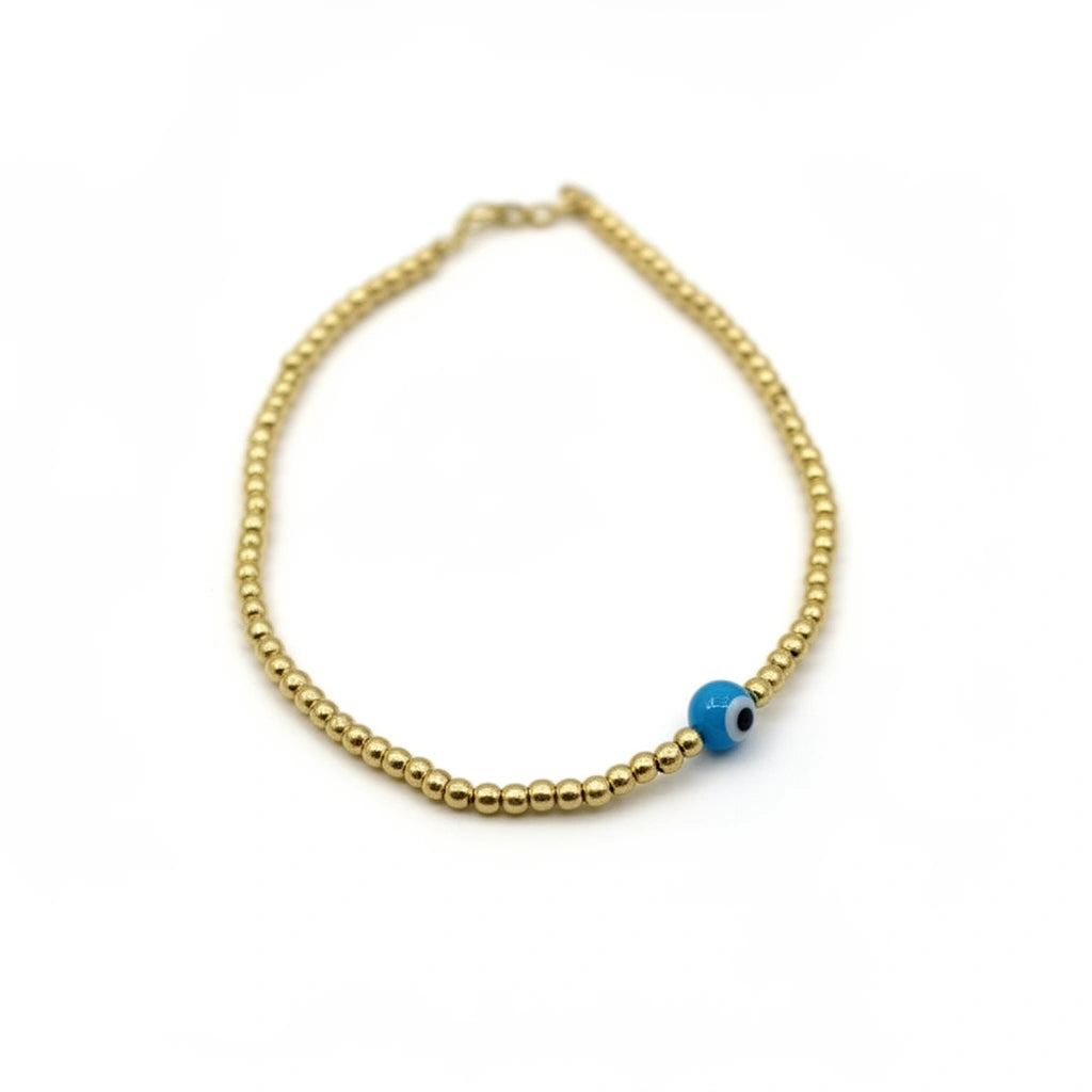 Pulsera de bolitas de oro 14k con ojo turco