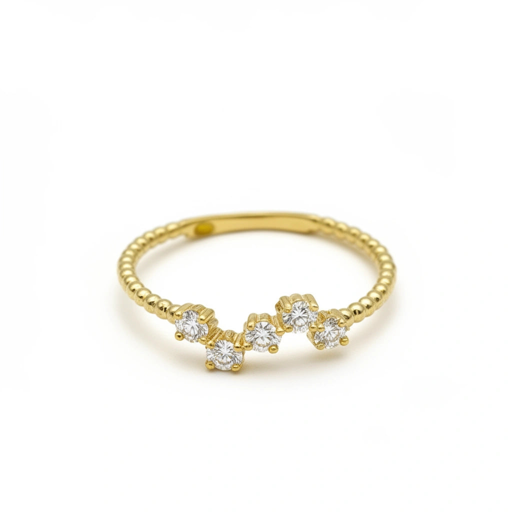 Anillo media alianza curva de oro 14k con incrustaciones de circonias