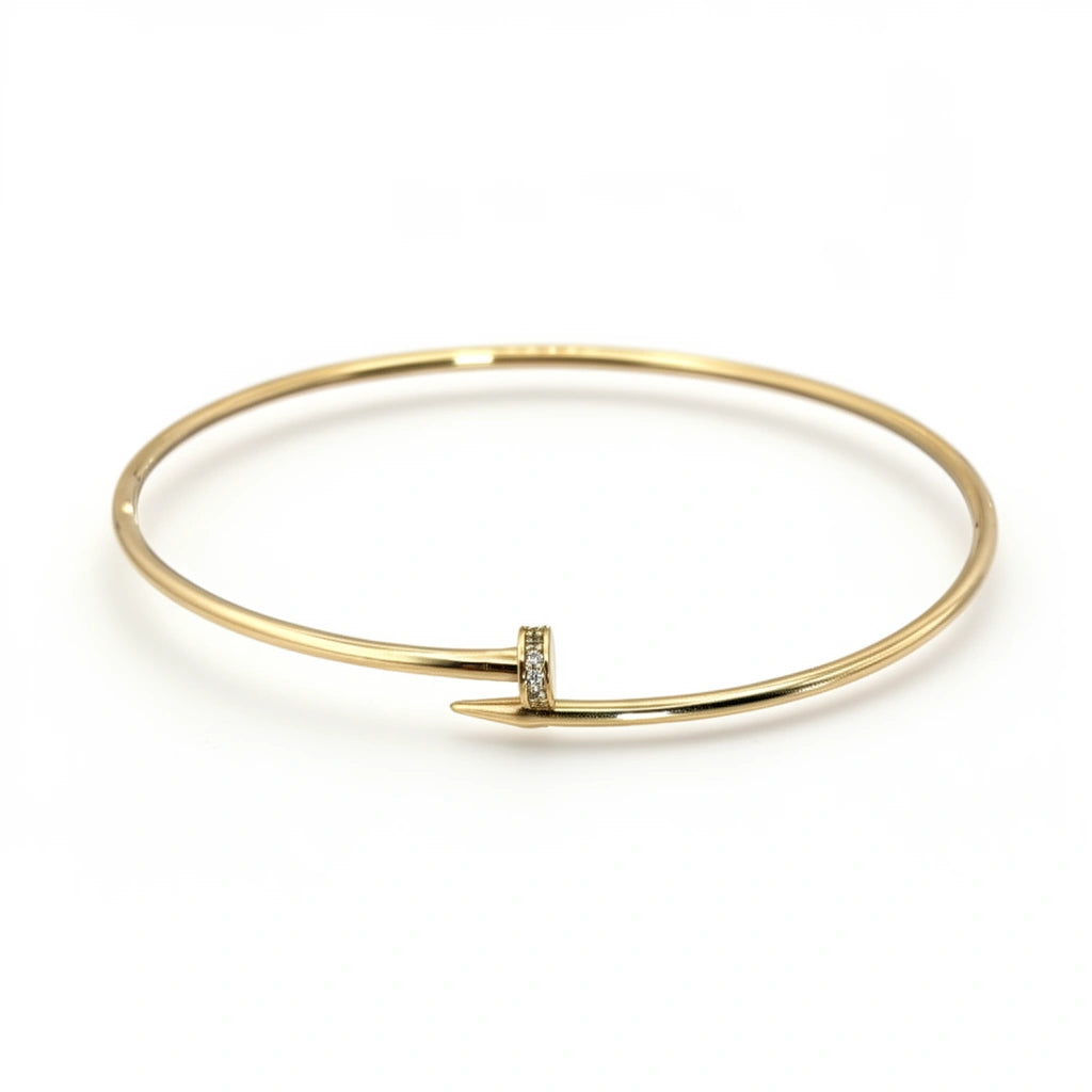 Brazalete de oro 10k tipo diseñador de clavo delgado hueco con circonias 18 cm