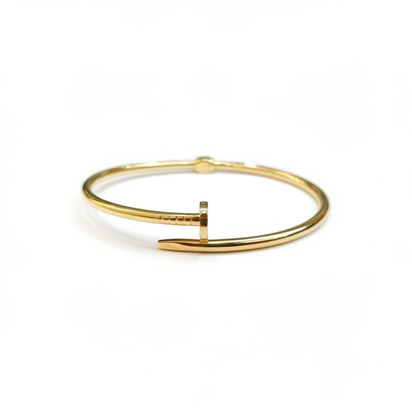 Brazalete de oro 10k tipo diseñador de clavo grueso liso semi hueco 18 cm