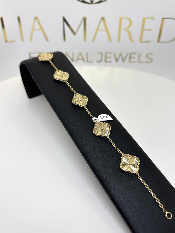 Pulso de flores grandes doradas de oro 14k