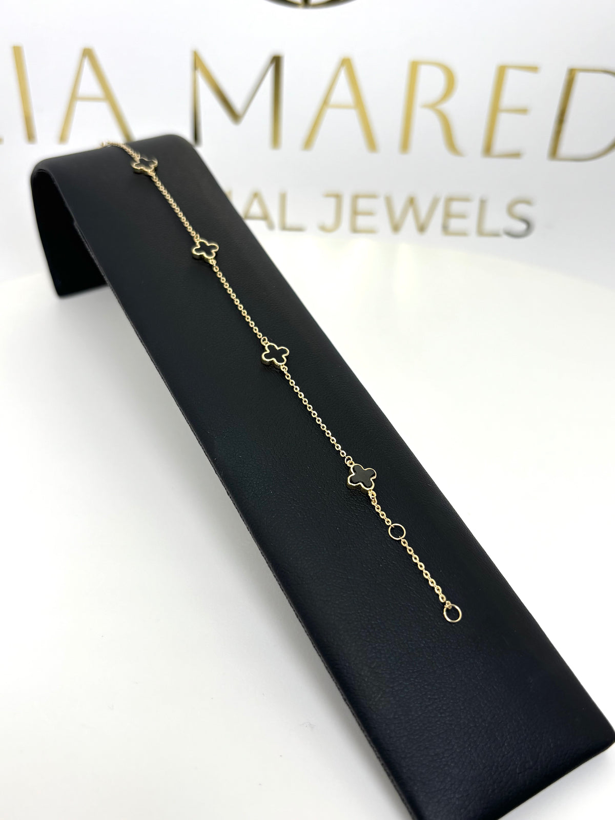 Pulsera de treboles negros de oro 14k con piedra onix para dama