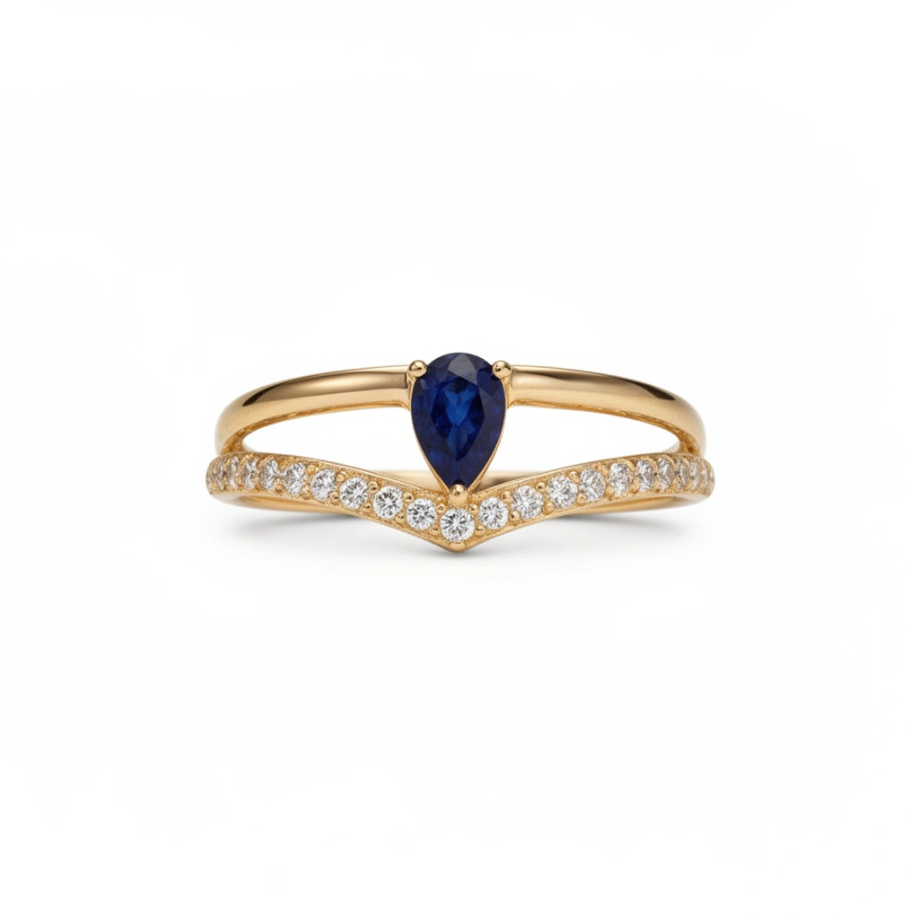 Anillo oro 10k con piedra azul corte pera y circonias