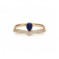 Anillo oro 10k con piedra azul corte pera y circonias