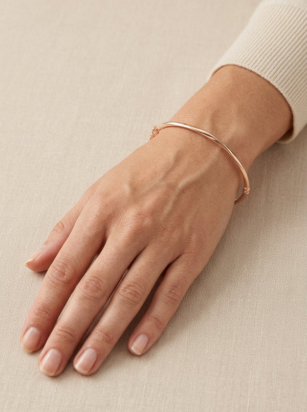 Brazalete de oro rosa 14k  hueco diseño torcido Mod 5571 - 18 cm
