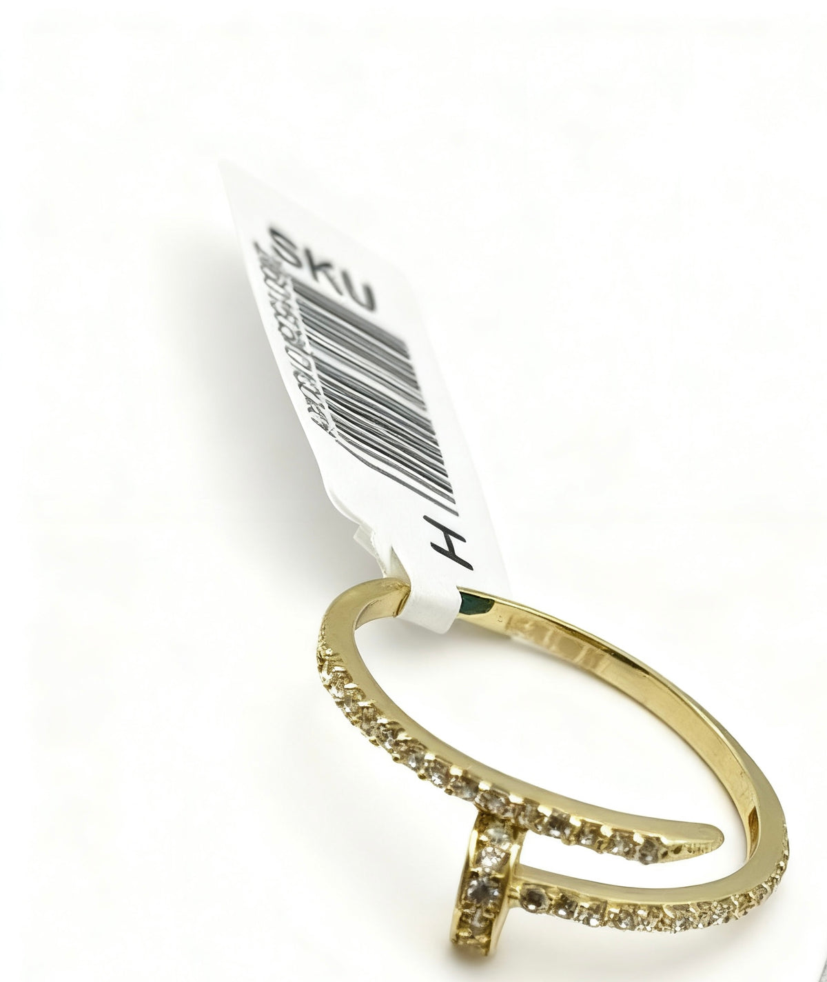 Anillo silueta de claro de oro 14k con incrustaciones de circonias