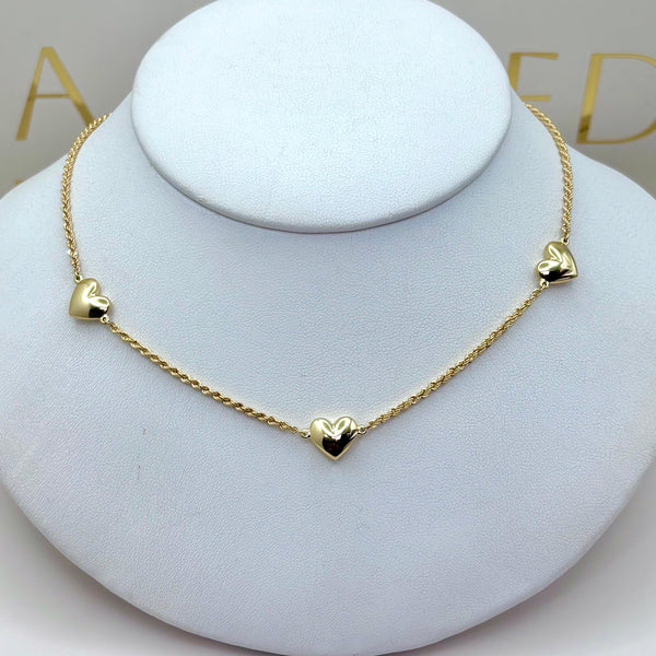 Gargantilla torsal con corazones de oro 14k