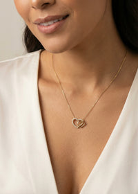 oro 14K con doble corazón y circonias