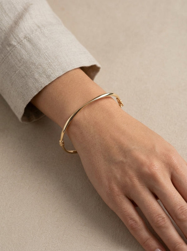 Brazalete de oro 14k  hueco diseño torcido Mod 5570 - 18 cm