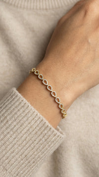 Pulsera de oro 10k silueta de gotas con incrustaciones de circonias -18 cm