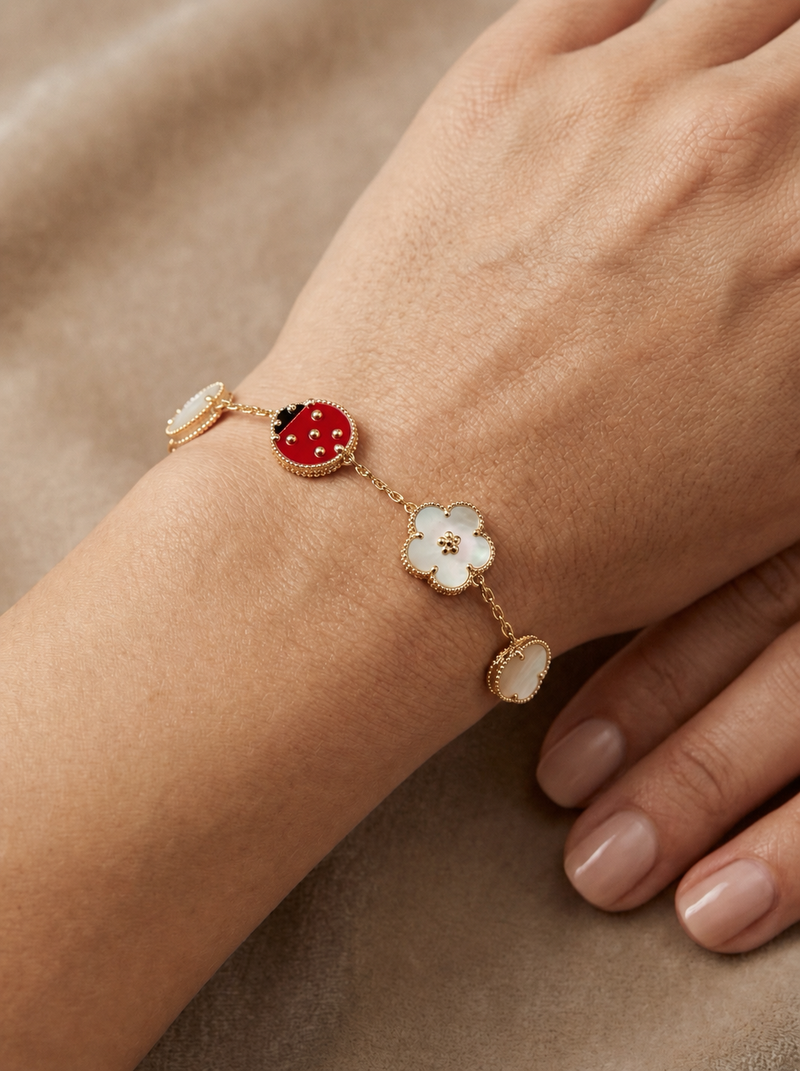Pulsera de oro 10k tipo diseñador de catarina y flores madre perla Mod 5699 - 18 cm