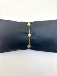 Pulsera de tréboles pequeños dorados de oro 14k