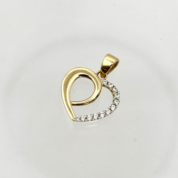 Dije de silueta de corazón de oro 14k con incrustaciones de circonias Mod. 1117