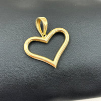 Dije de silueta de corazón liso de oro 14k