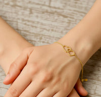 Pulsera de silueta de corazones de oro 14k
