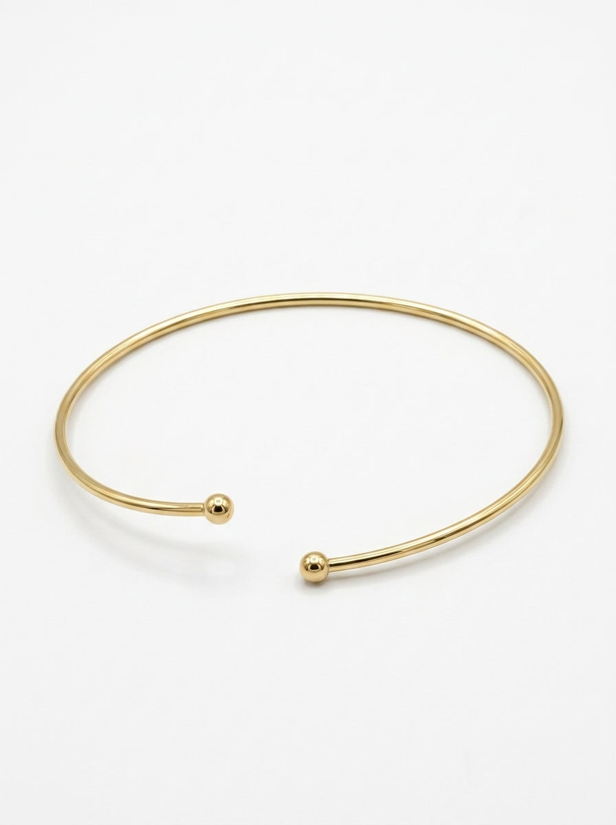 Brazalete de oro 14k abierto con esferas en los extremos Mod 5990 - 18 cm