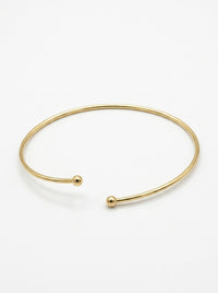Brazalete de oro 14k abierto con esferas en los extremos Mod 5990 - 18 cm