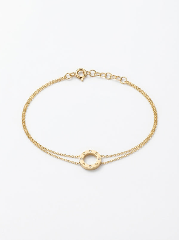 Pulsera de oro 14k tipo diseñador con círculo chico de tornillos y circonias Mod 6114 - 18 cm