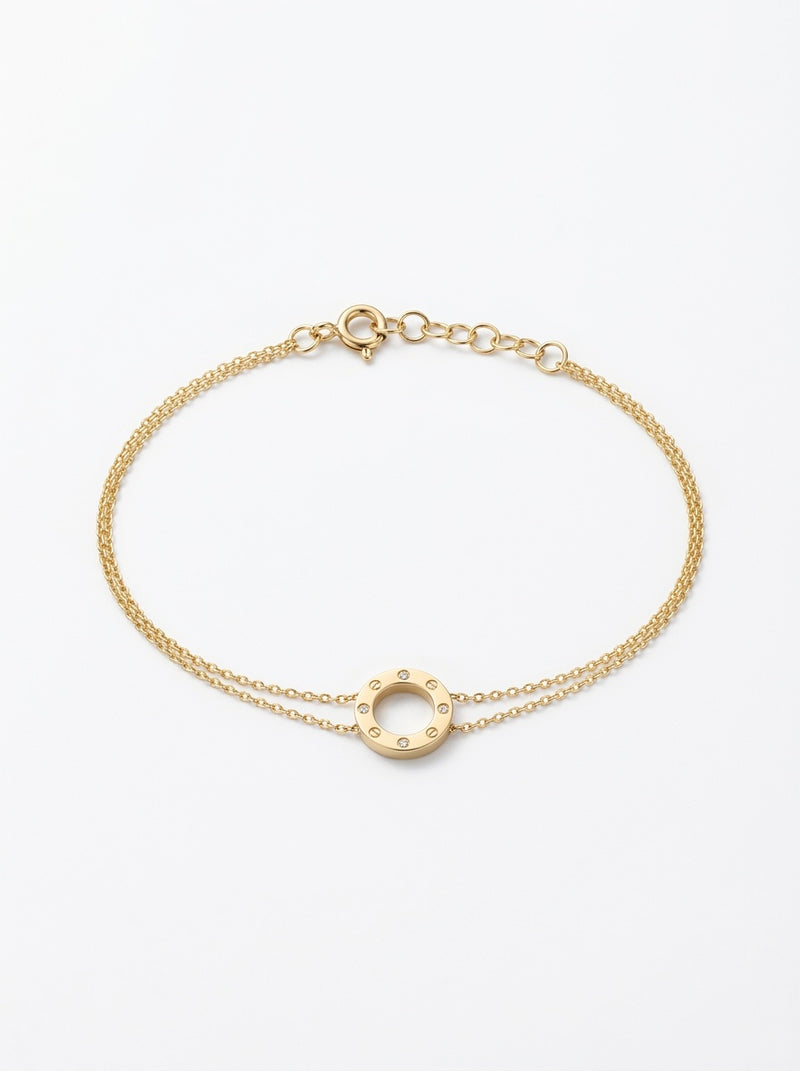 Pulsera de oro 14k tipo diseñador con círculo chico de tornillos y circonias Mod 6114 - 18 cm