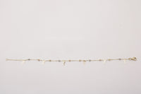 Pulsera de oro 14k con dijes de moño y esferas diamantadas tricolor Mod 6300 - 18 cm, foto real