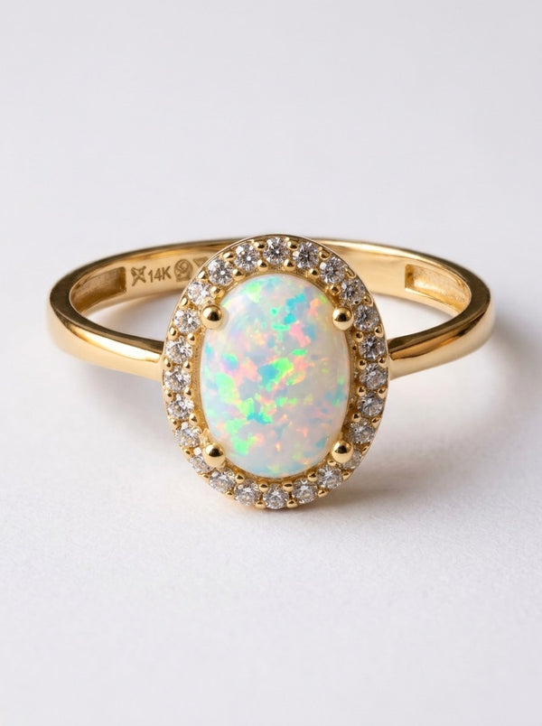 Anillo de oro 14k con ópalo ovalado y halo de circonias Mod 6355