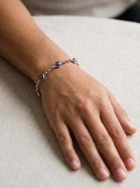 Pulsera de oro blanco 14k tejido rolo con ojos turcos azules Mod 6371 - 18 cm